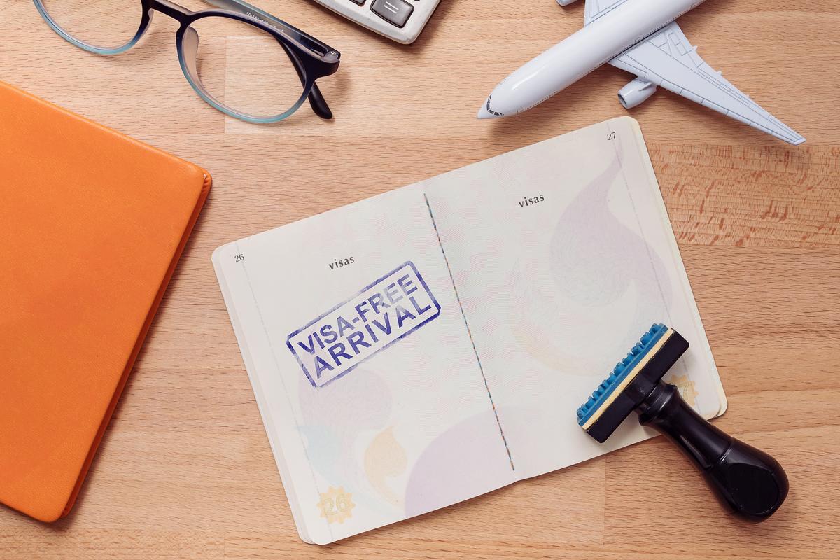 Tourist showing passport with stamp after getting vietnam visa in 1 day